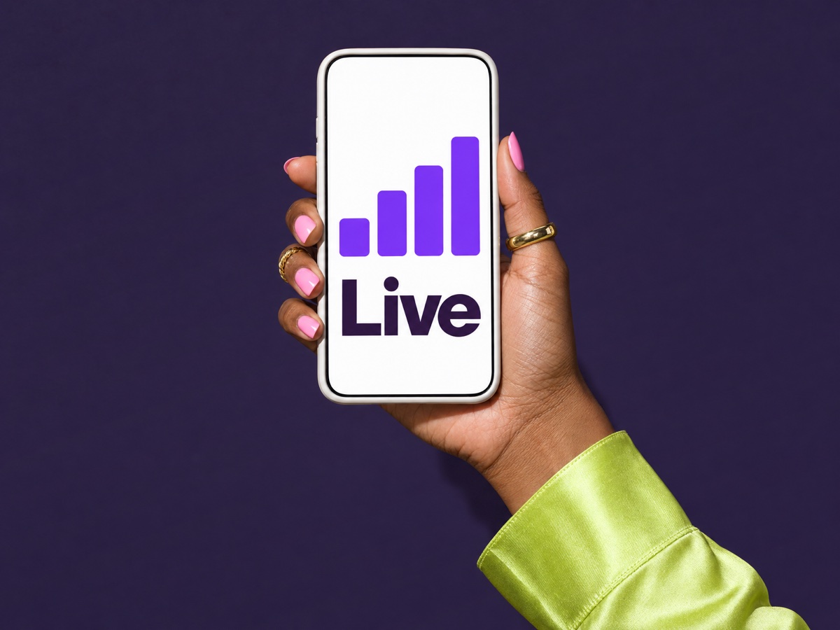 Hand holding a phone with full signal bars and the word Live.